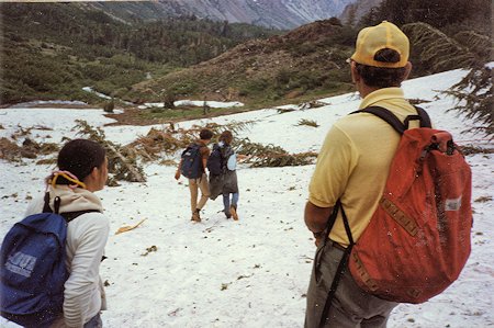 Helping the injured hiker descend to safety Helping the injured hiker descend to safety