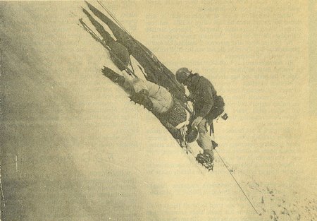 An 'injured' climber is checked by a member of the Mammoth Lakes Search and Rescue Team on a steep frozen slope above Silver Lake