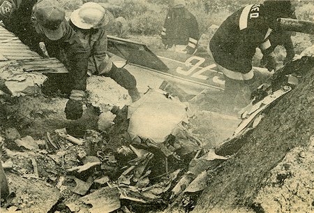 Firemen, paramedics and police officers had the unpleasant task of sifting through the wreckage of a plane which crashed near Conway Summit Monday afternoon. The pilot was killed in the crash. Firemen, paramedics and police officers had the unpleasant task of sifting through the wreckage of a plane which crashed near Conway Summit Monday afternoon. The pilot was killed in the crash.