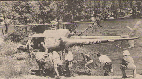 Members of the June Lake Mountain Rescue Team, paramedics from Medic III and Inyo National Forest personnel rush to load Lee Wilson Sloan of San Francisco on to a helicopter along the shore of McCloud Lake after Sloan collapsed along the trail. Members of the June Lake Mountain Rescue Team, paramedics from Medic III and Inyo National Forest personnel rush to load Lee Wilson Sloan of San Francisco on to a helicopter along the shore of McCloud Lake after Sloan collapsed along the trail.