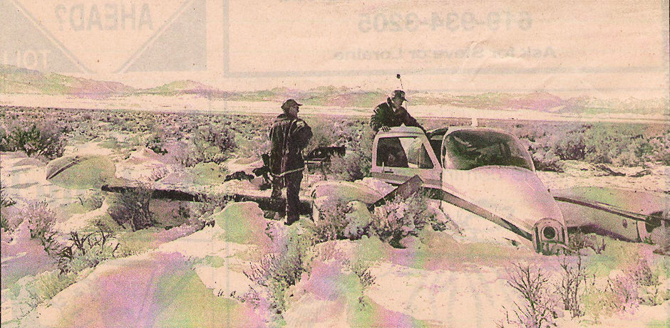 Rescuers inspect a plane that crash-landed Christmas Eve morning near the Owens River Rescuers inspect a plane that crash-landed Christmas Eve morning near the Owens River