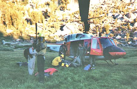 Plane Crash near Deer Lakes - preparing to load victims in Navy helicopter