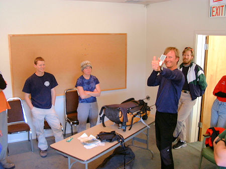 Jeff Holmquist shows new candidates how to signal with a mirror - what's in a SAR pack demo - May 11, 2002 Jeff Holmquist shows new candidates how to signal with a mirror - what's in a SAR pack demo - May 11, 2002