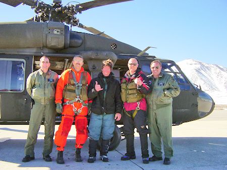 Helicopter crew and subject (center) Helicopter crew and subject (center)