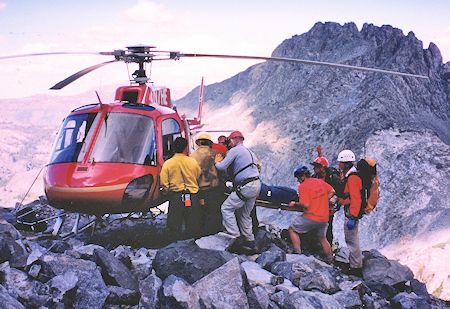 Mono SAR loading subject into Helo 525 - Bill Greene Photo Mono SAR loading subject into Helo 525 - Bill Greene Photo
