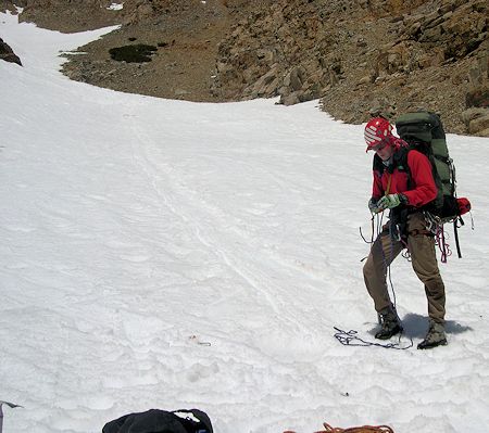 Track of subjects slide down the snow can be seen as preparations start for belaying him down the slope - DM Photo Track of subjects slide down the snow can be seen as preparations start for belaying him down the slope - DM Photo
