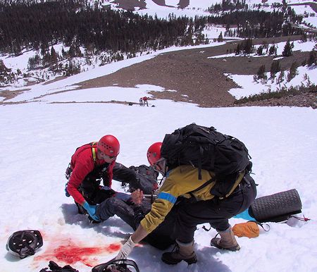 Preparing to move victim into litter - JW Photo Preparing to move victim into litter - JW Photo