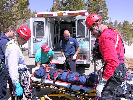 Preparing to load victim in ambulance - JW Photo Preparing to load victim in ambulance - JW Photo