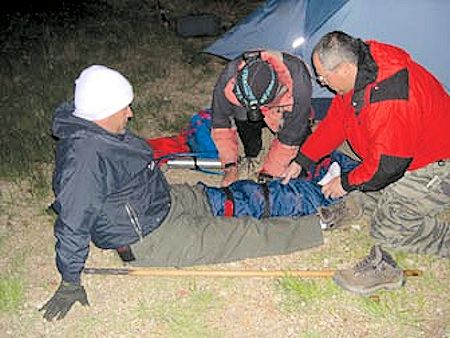Jeff Holmquist and Victor Aquirre administer first-aid to Robert Aranaga Jeff Holmquist and Victor Aquirre administer first-aid to Robert Aranaga