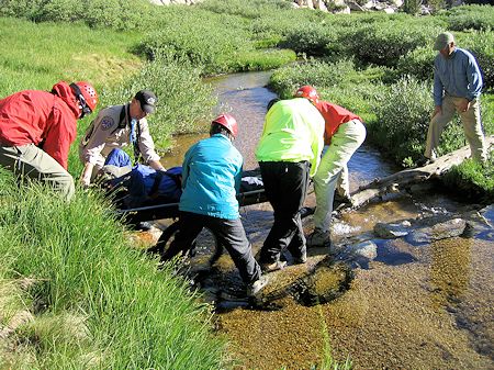 Moving Kauffman across stream to landing zone Moving Kauffman across stream to landing zone