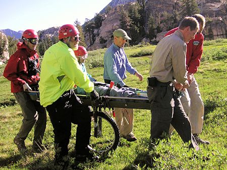 Moving Richard Kauffman to helicopter landing zone Moving Richard Kauffman to helicopter landing zone
