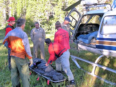 Somoano moved by litter to helicopter landing zone Somoano moved by litter to helicopter landing zone