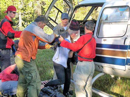 Assisting Somoana into CHP helicopter