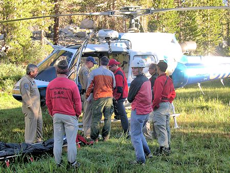 Final team review before helicopter departs Final team review before helicopter departs