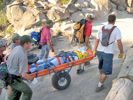 Transporting the subject in wheeled litter