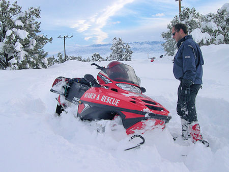 Snowmobiles used in deep snow in search for missing motorist Snowmobiles used in deep snow in search for missing motorist
