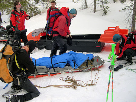 Preparing to move Perrault into sled Preparing to move Perrault into sled