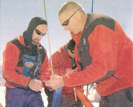 Search and Rescue volunteers Steve Case (left), John Hronesh (center) and Barry Beck (right) prepare their gear to join in the search - Susan Morning Photo Search and Rescue volunteers Steve Case (left), John Hronesh (center) and Barry Beck (right) prepare their gear to join in the search - Susan Morning Photo