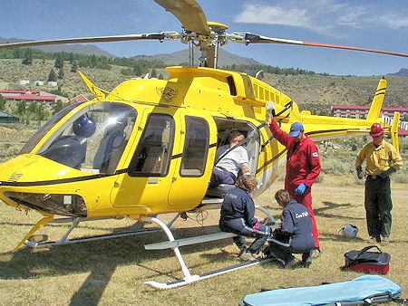 Care Flight treats patient before moving him to their helicopter Care Flight treats patient before moving him to their helicopter