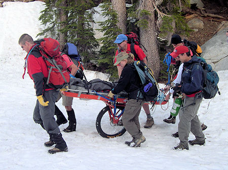 Transporting subject by wheeled litter - Dave Michalski Photo