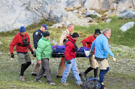 Moving the injured party to the helicopter Moving the injured party to the helicopter
