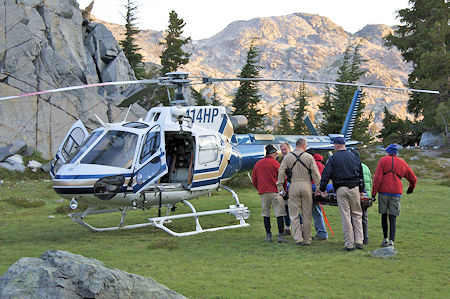 Moving the injured party to the helicopter Moving the injured party to the helicopter