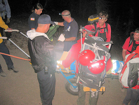 Ops 12-506 Crystal Crag - preparing to transport on wheeled litter Ops 12-506 Crystal Crag - preparing to transport on wheeled litter