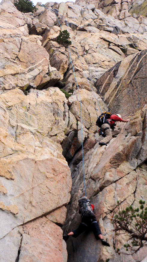 Team climbing to subject