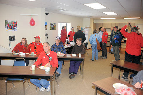 Visitors eating and circulating in upstairs meeting room