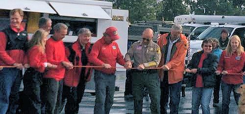 President Dan Corning and Sheriff Ralph Obenberger cut the rope President Dan Corning and Sheriff Ralph Obenberger cut the rope