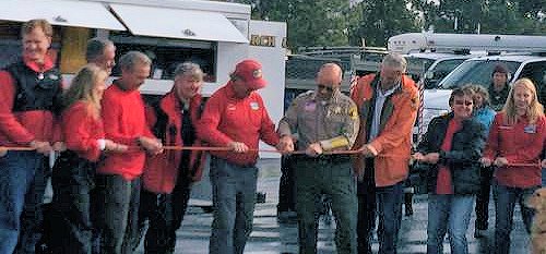 President Dan Corning and Sheriff Ralph Obenberger cut the rope