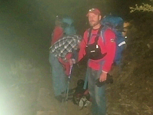 Team hiking in after dark Team hiking in after dark