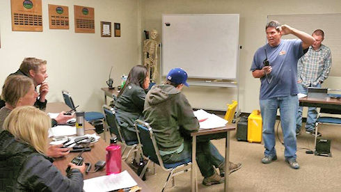 Rick Dodson instructing on how the team radios work