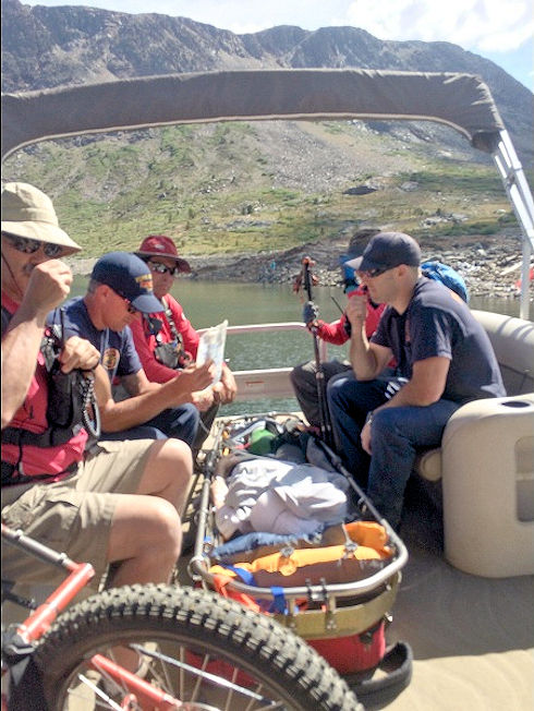 Transporting victim via ferry boat across Saddlebag Lake Transporting victim via ferry boat across Saddlebag Lake