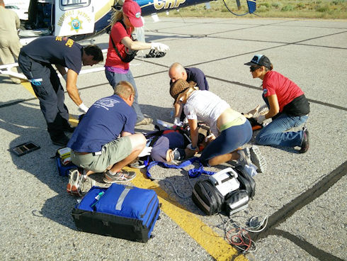 Subject being prepared for flight to hospital Subject being prepared for flight to hospital