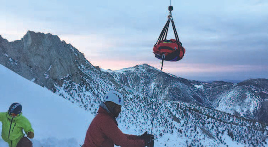 Viren Perumal guides litter as it is hoised to CHP H40 Helicopter