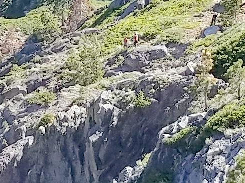 Ops 16-348 - If you look carefully you can see the team rigging lowering system above cliffs Ops 16-348 - If you look carefully you can see the team rigging lowering system above cliffs