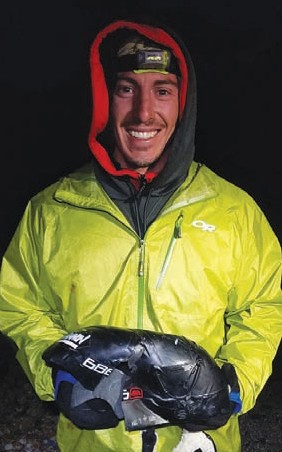 Skier David Arnold holds up what's left of his helmet after a fall down Ellery Bowl - Brank Kral photo