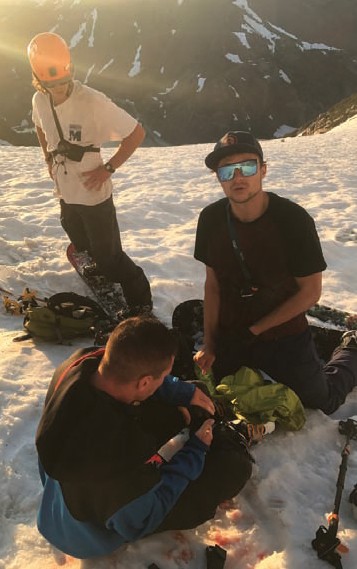 Mike Mitchell and Bronco Kral assist injured skier David Arnold - Josh Wray Photo