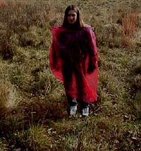 Girl wearing a bag with hole for head